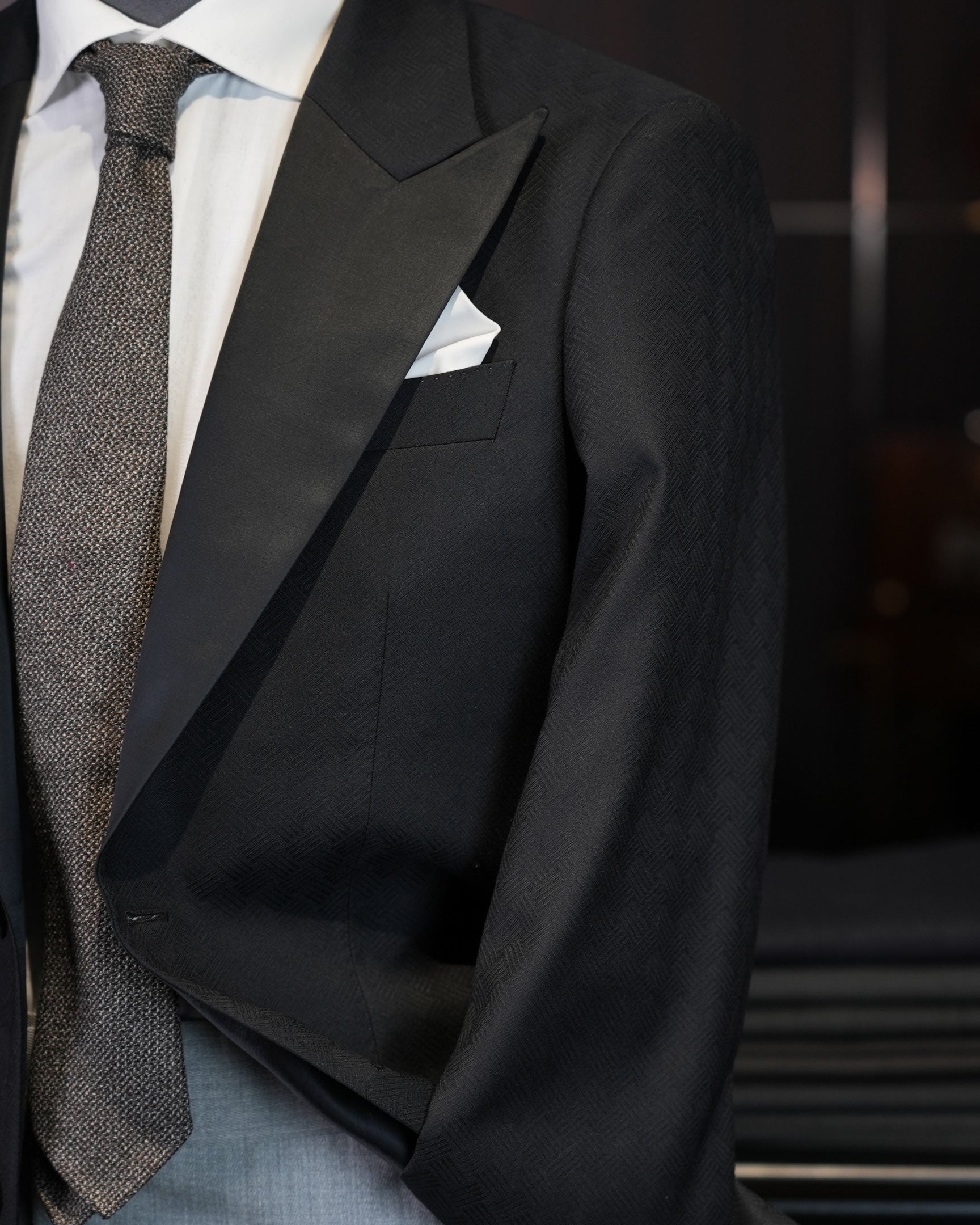 Dark black satin-paneled blazer