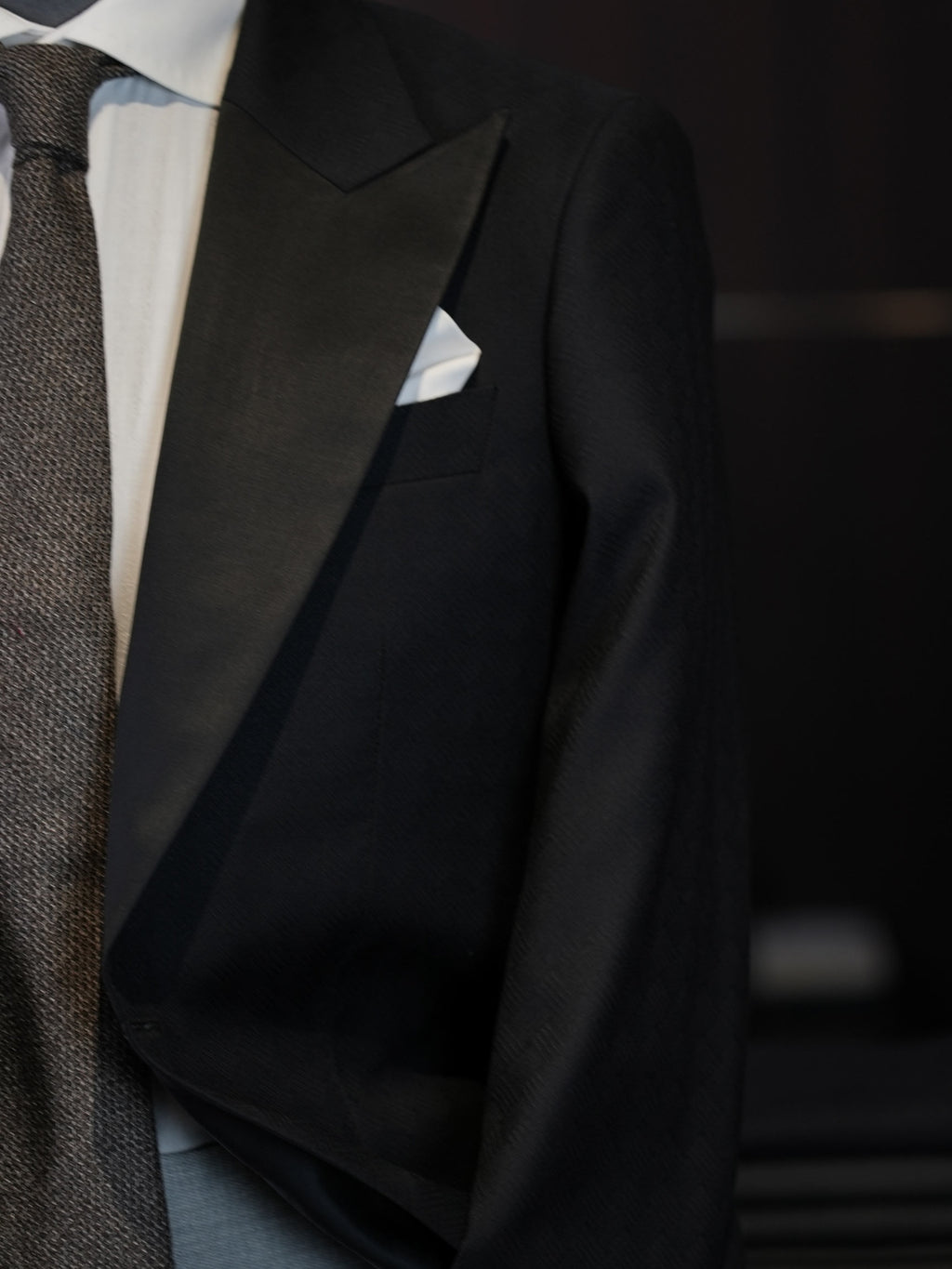 Dark black satin-paneled blazer
