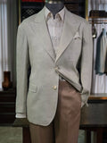 Apricot-colored linen single-breasted suit with a drawstring hem and twill pattern