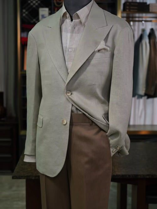 Apricot-colored linen single-breasted suit with a drawstring hem and twill pattern