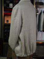 Apricot-colored linen single-breasted suit with a drawstring hem and twill pattern