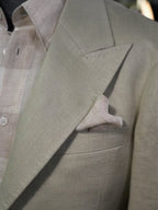 Apricot-colored linen single-breasted suit with a drawstring hem and twill pattern
