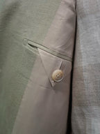 Apricot-colored linen single-breasted suit with a drawstring hem and twill pattern